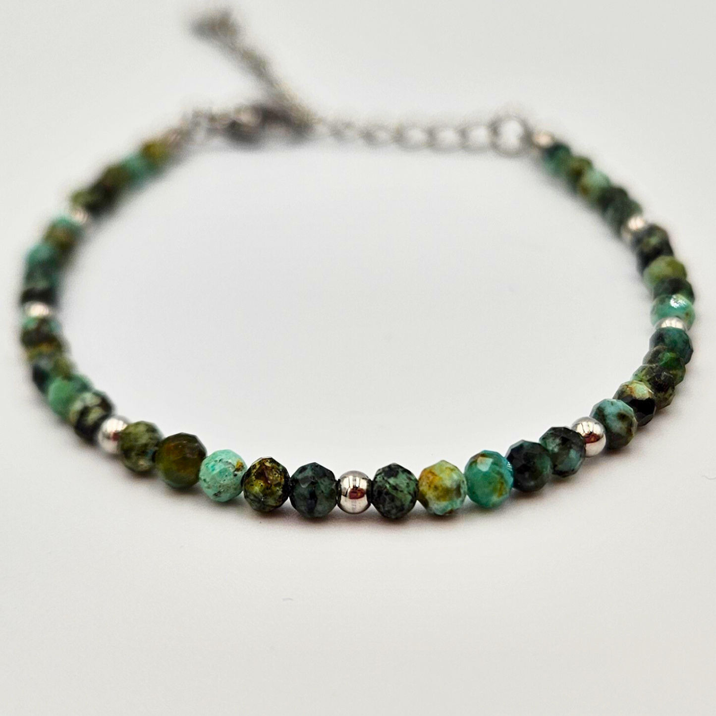 Armband gemaakt van stainless steel met facetgeslepen afrikaanse turkoois