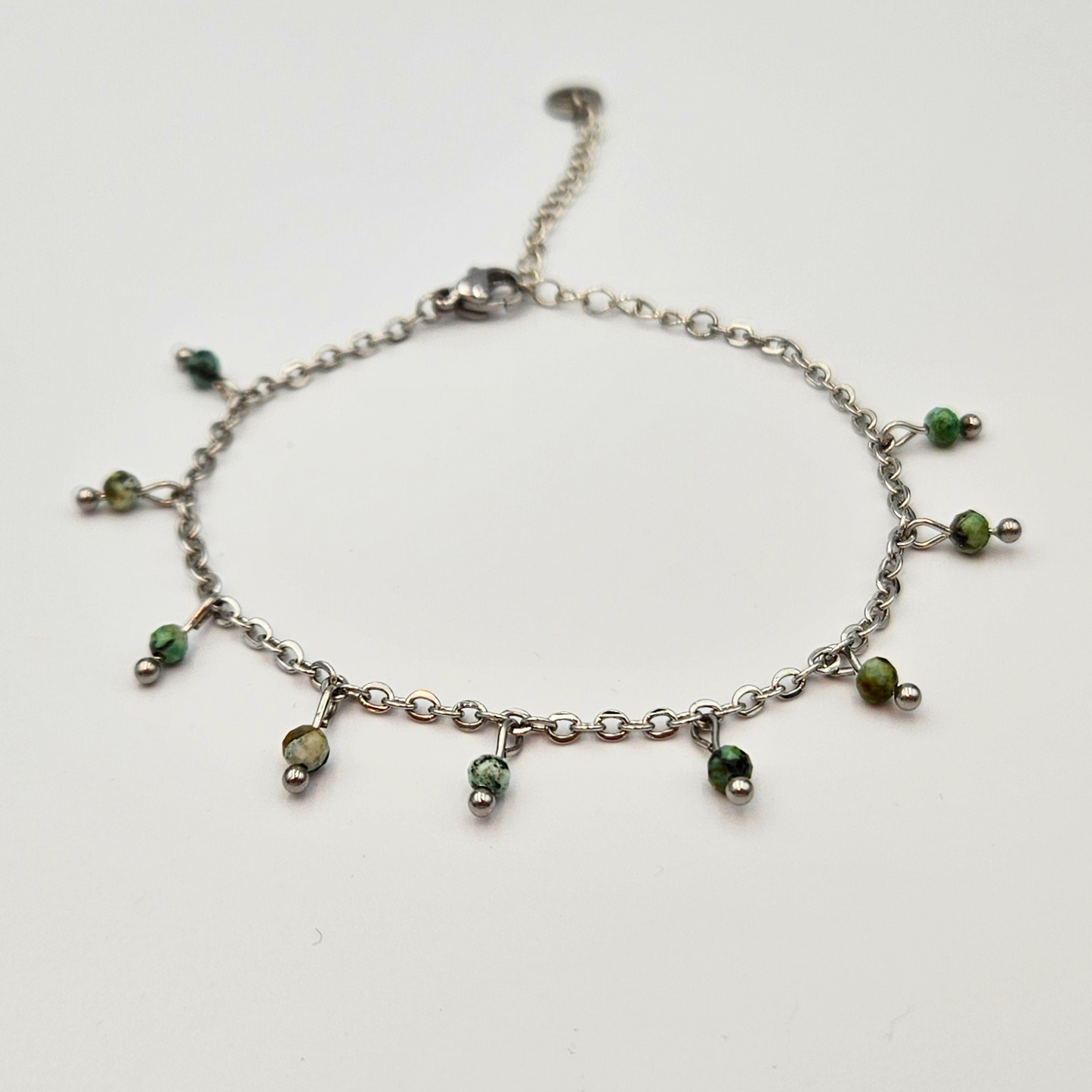 Armband gemaakt van stainless steel met facetgeslepen afrikaanse turkoois edelsteentjes