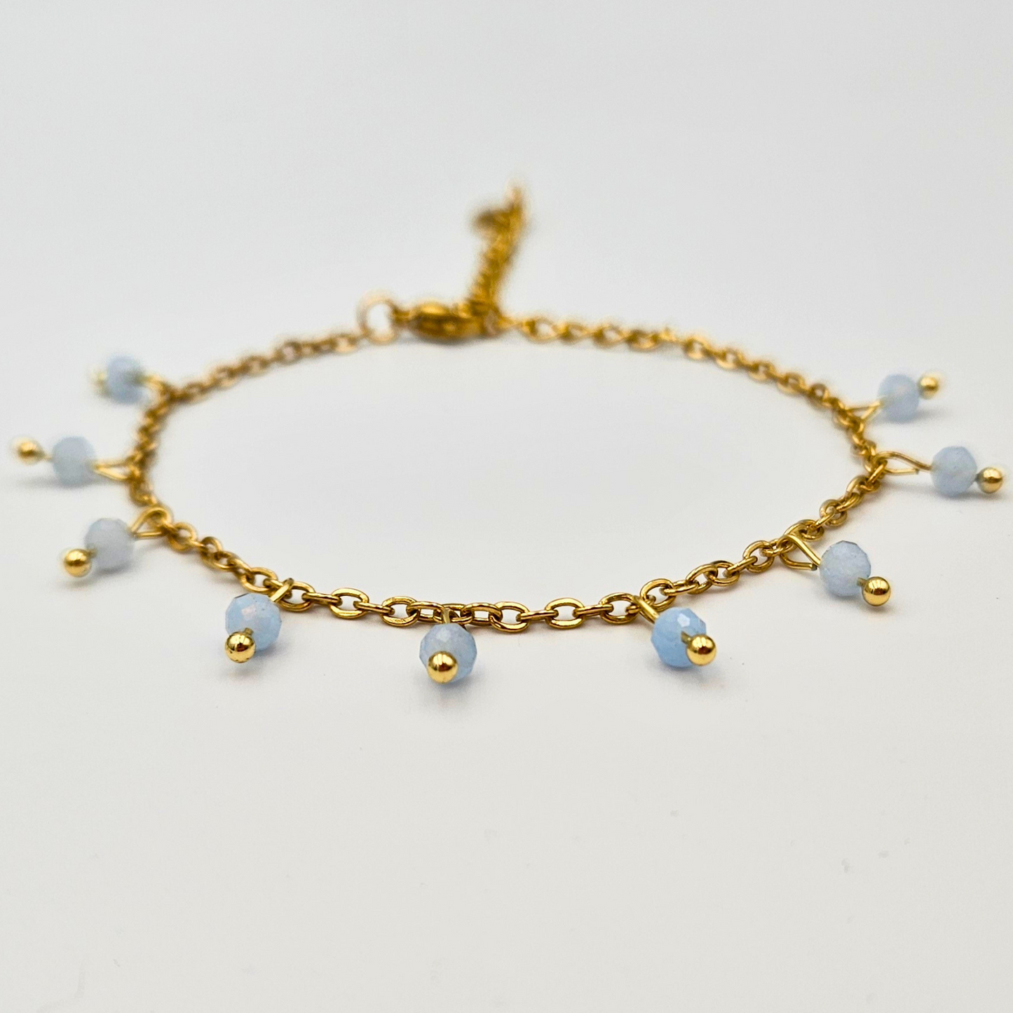 Armband van goldplated stainless steel met facetgeslepen aquamarijn