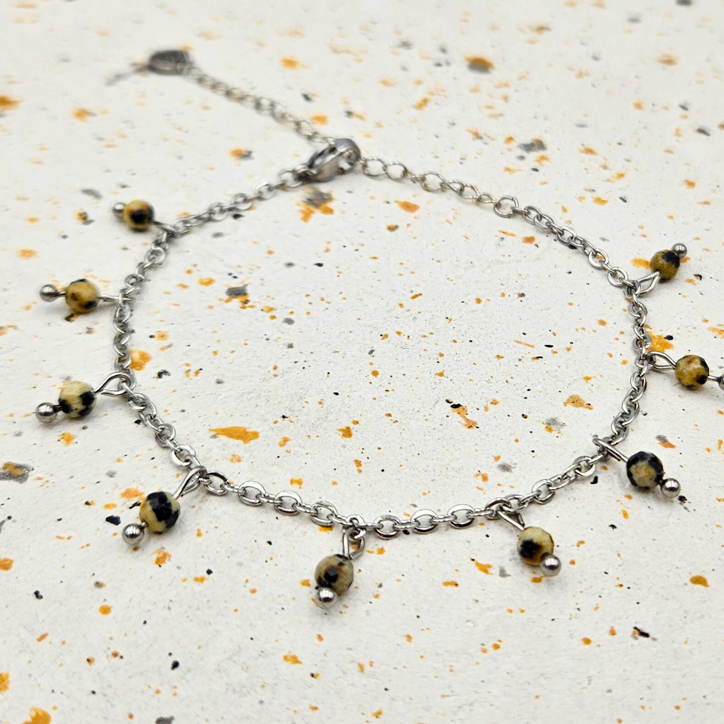 Armband gemaakt van stainless steel met facetgeslepen dalmatiër jaspis edelsteentjes