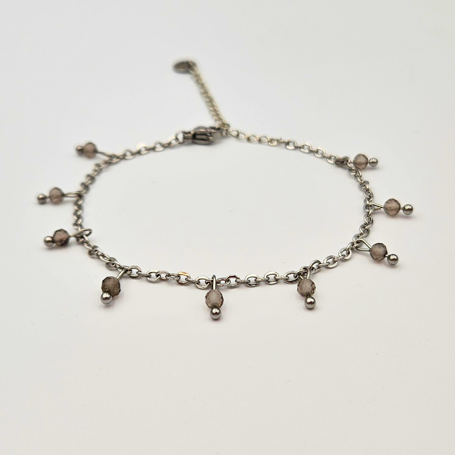 Armband gemaakt van stainless steel met facetgeslepen rookkwarts edelsteentjes