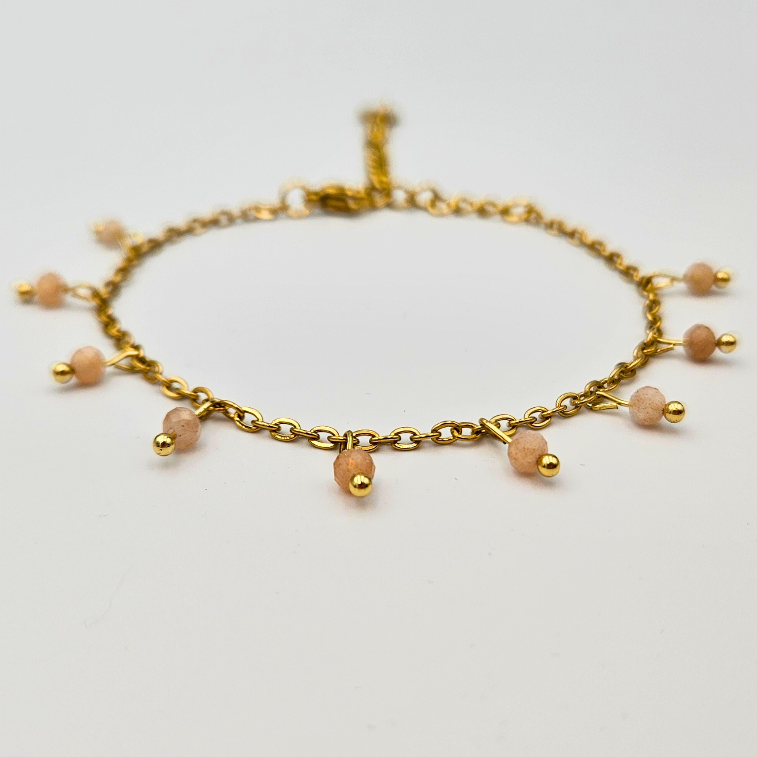 Armband van goldplated stainless steel met facetgeslepen zonnesteen