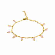 Armband van goldplated stainless steel met facetgeslepen aardbeienkwarts