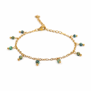 Armband van goldplated stainless steel met facetgeslepen afrikaanse turkoois