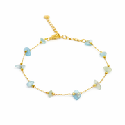 Armband van goldplated stainless steel met aquamarijn chunks