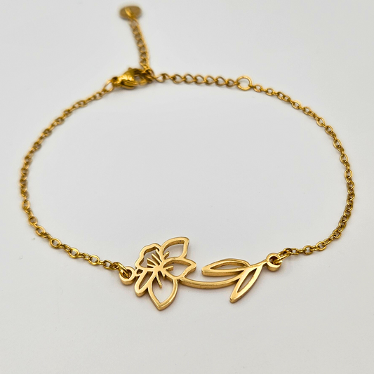 Armband van goldplated stainless steel met geboortebloem van maart: de narcis