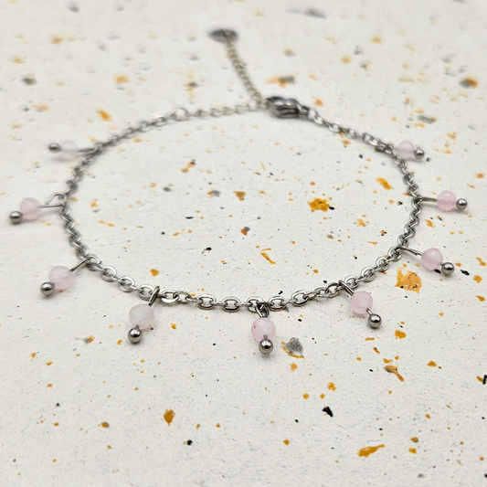 Armband gemaakt van stainless steel met facetgeslepen rozenkwarts edelsteentjes
