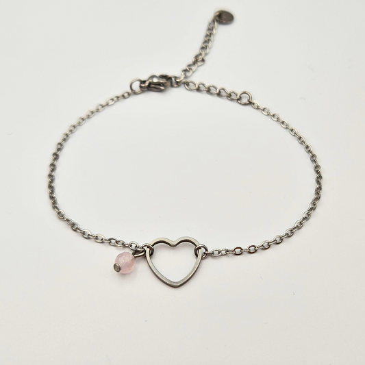 Armband van zilverkleurig stainless steel met hart bedel en rozenkwarts