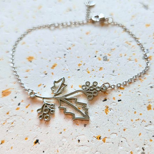 Armband gemaakt van stainless steel met geboortebloem van december: de hulst