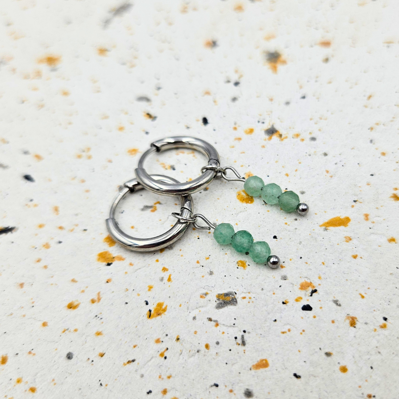 Oorbellen gemaakt van stainless steel met facetgeslepen aventurijn