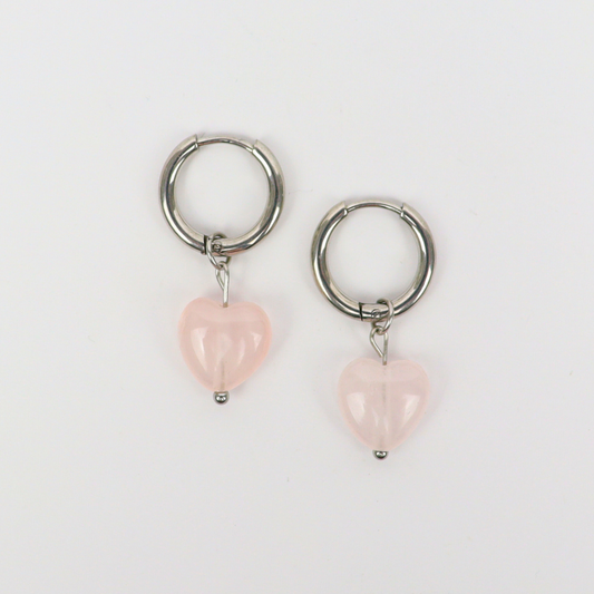 Oorbellen gemaakt van stainless steel met hartvormige rozenkwarts hanger